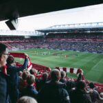 Fans raising the banner high after Liverpool wins 2-0 against Totten ham FC